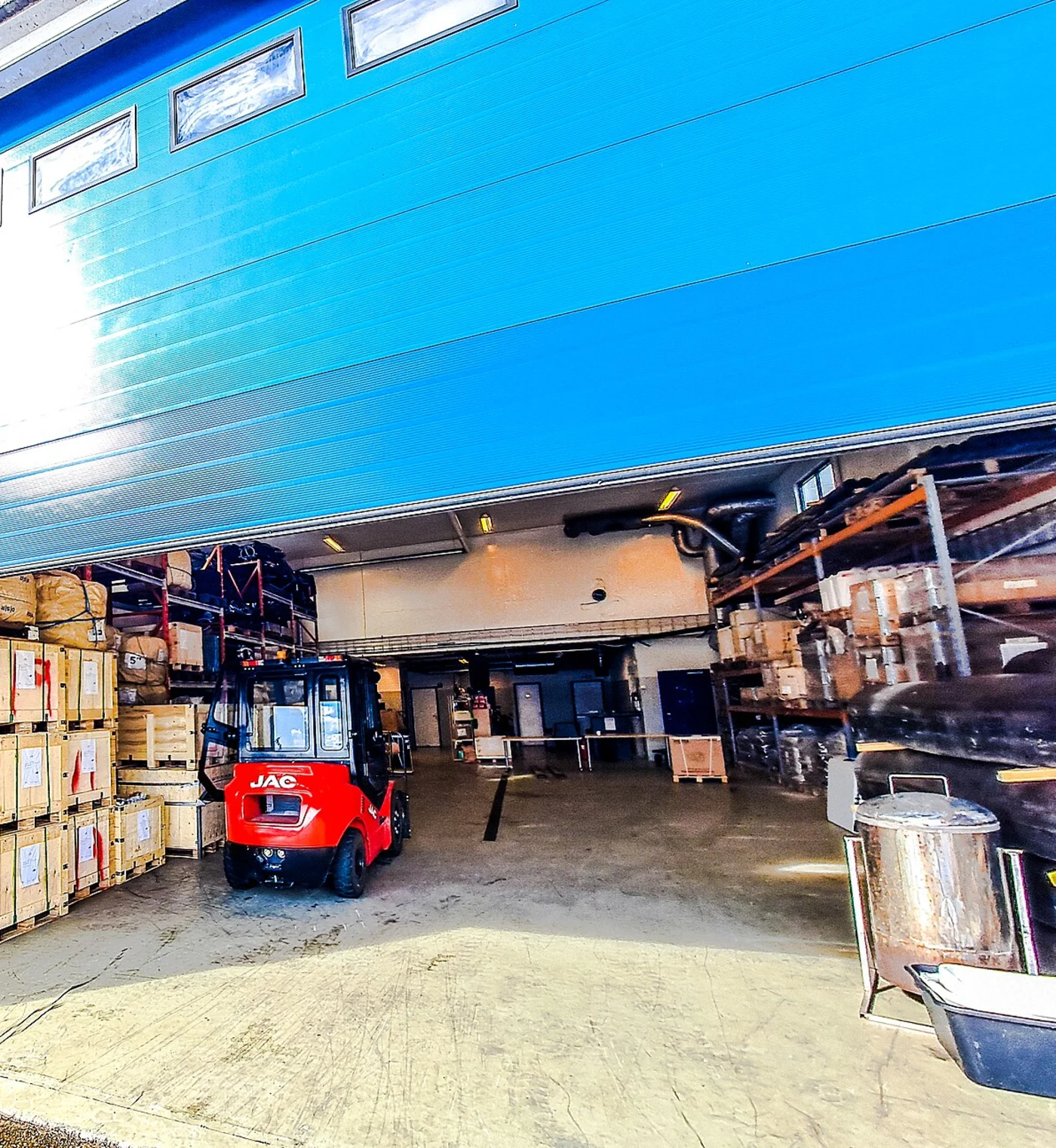 Blue commercial sectional warehouse door