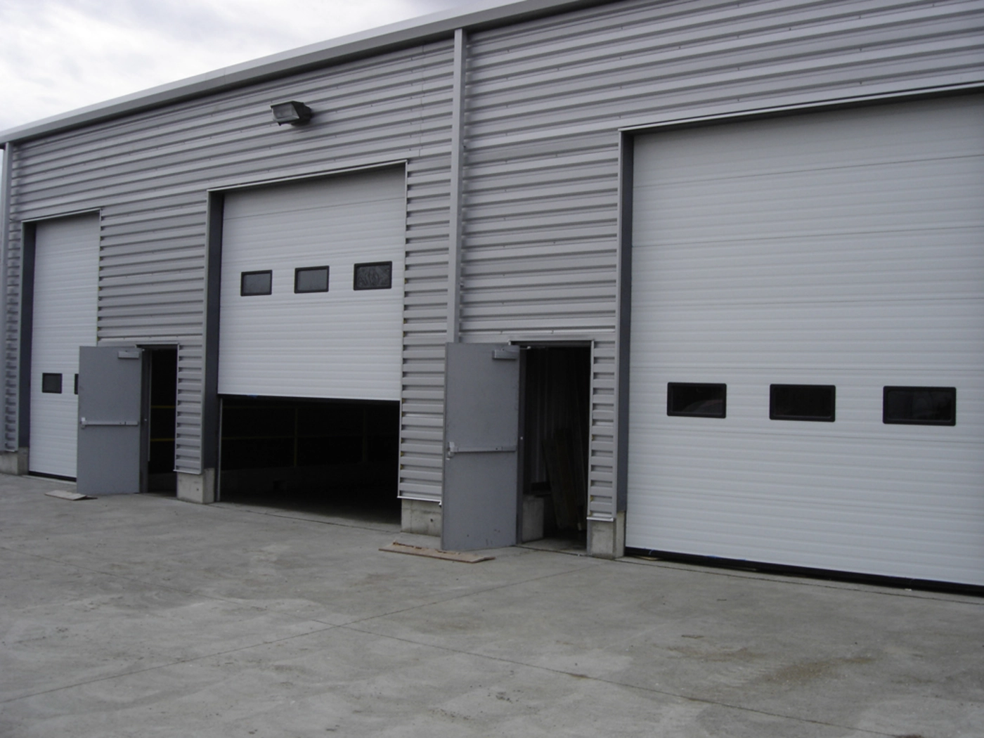 White commercial sectional garage doors